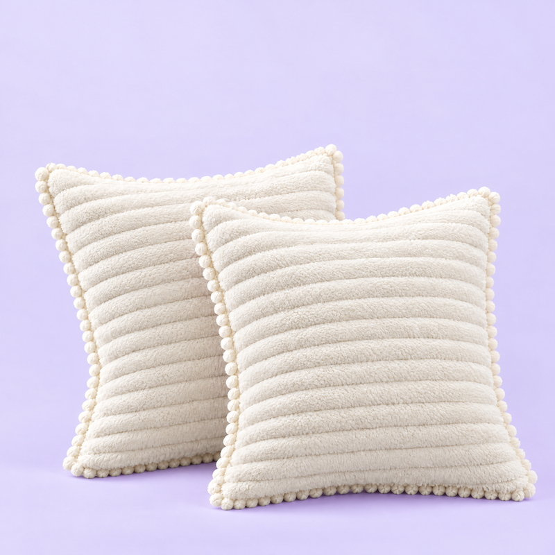 Two ribbed shams with pom-pom trim
