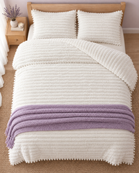 Overhead view of a bed made with the Cloudline comforter and shams