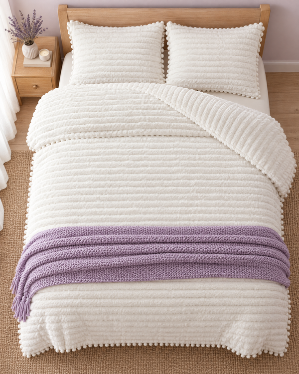 Overhead view of a bed made with the Cloudline comforter and shams