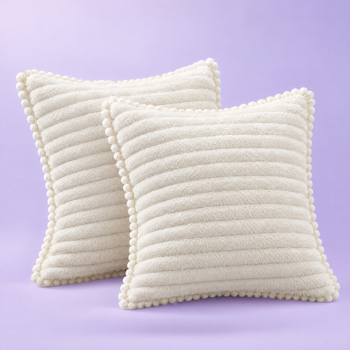 Two ribbed faux-fur shams with pom-pom trim