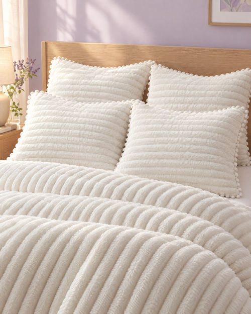 Four ribbed shams styled on a bed